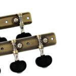 Clavijero negro envejecido para guitarra clásica con perillas negras, vista lateral.